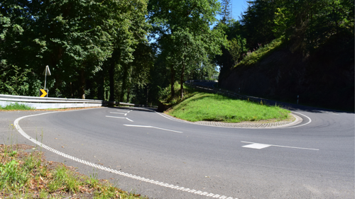 White road markings on a bend in Luxembourg