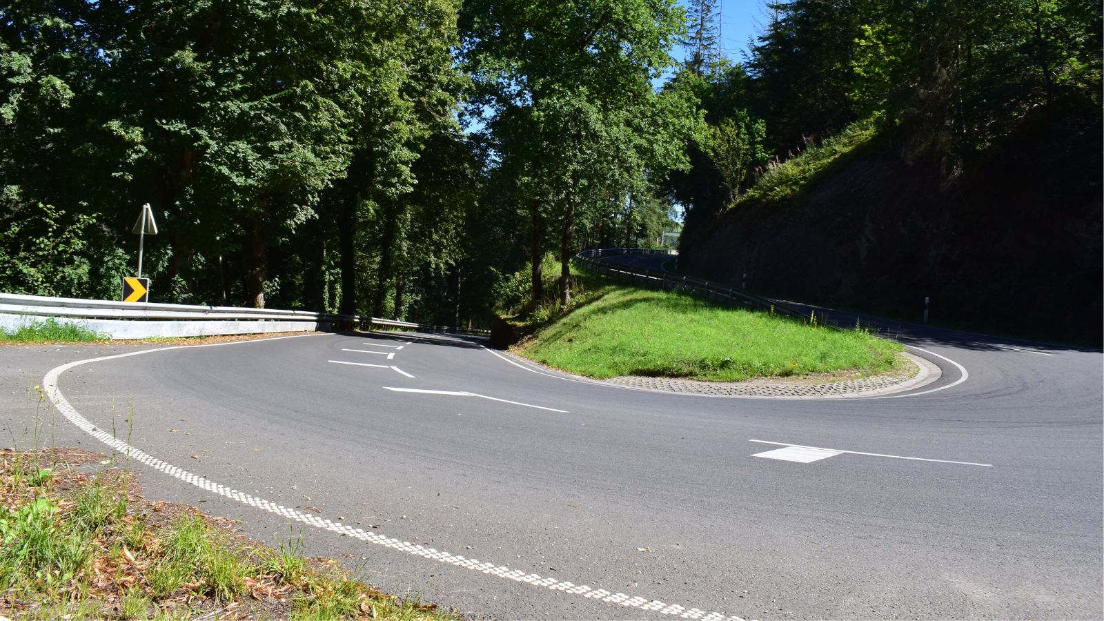 White road markings on a bend in Luxembourg