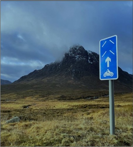 Blue road sign indicating route for motorcycles